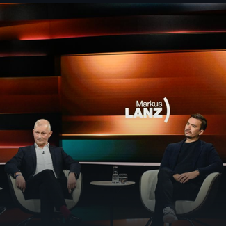 Olaf Köller sitzt auf einem Stuhl bei Markus Lanz